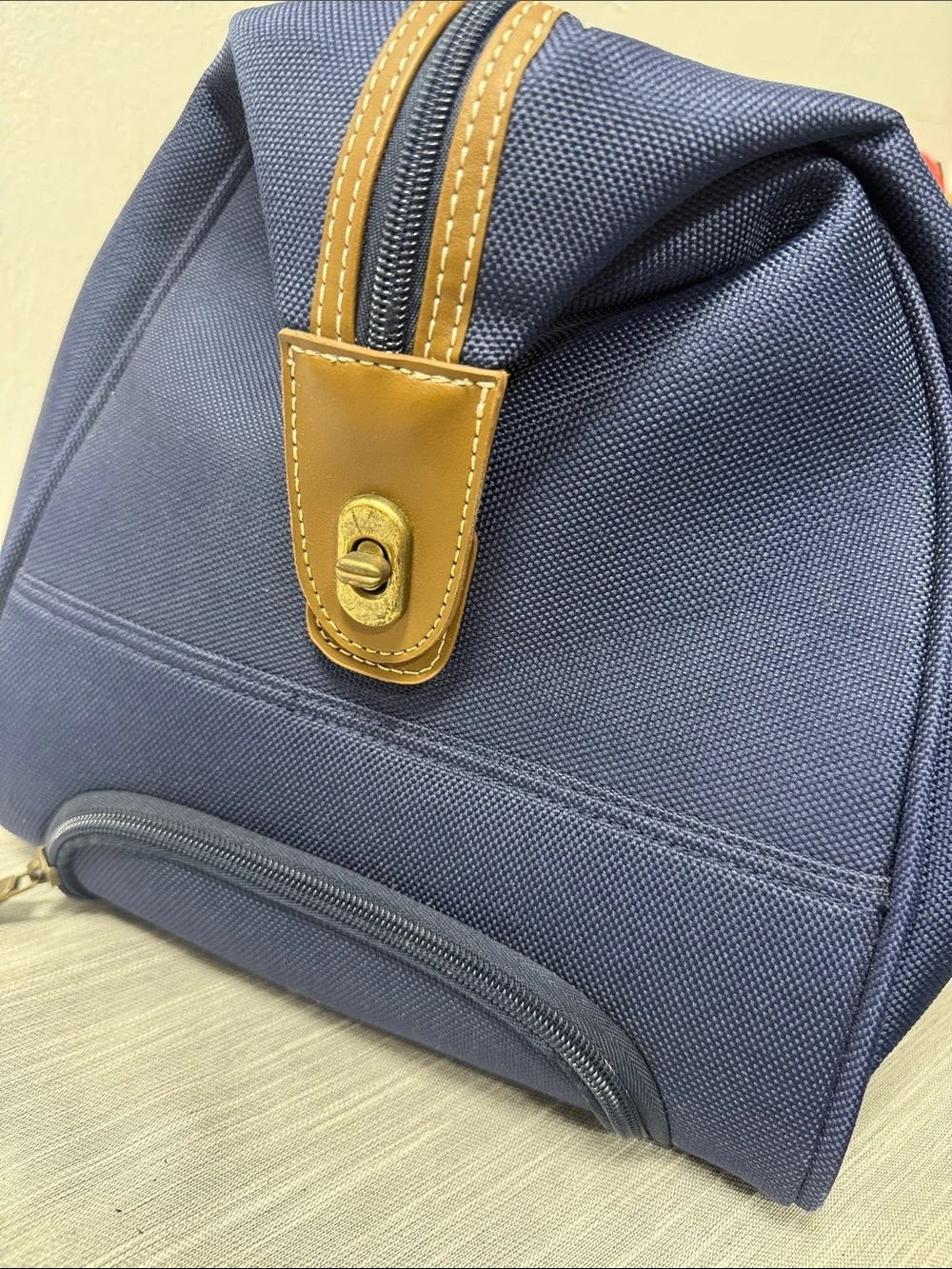 Tommy Hilfiger Navy rolling Duffel with Red & White Center Stripe  carry on